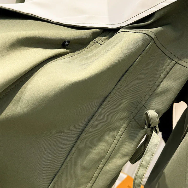 Folded lightweight waterproof windbreaker jacket, emphasizing its portability and compact design