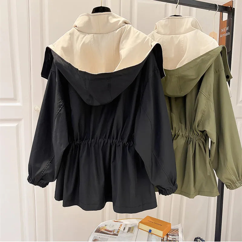 Back view of a women's chic waterproof windbreaker, highlighting its streamlined silhouette