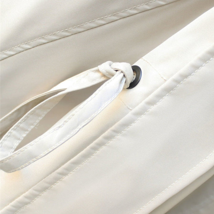 Detail of the waterproof zipper on a women's lightweight windbreaker jacket, ensuring dryness
