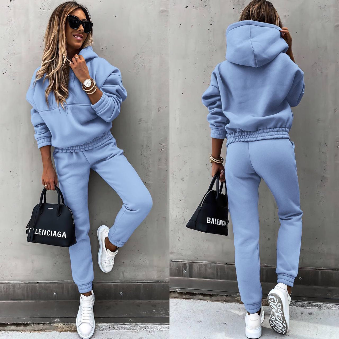 Chic women's matching grey sweatshirt & jogger set, perfect for comfortable casual wear & loungewear.