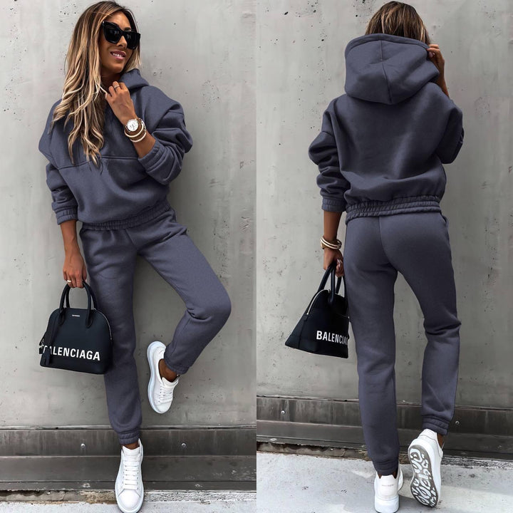 Side view of woman in relaxed fit women's chic grey sweatshirt and jogger set, ideal for cozy loungewear.