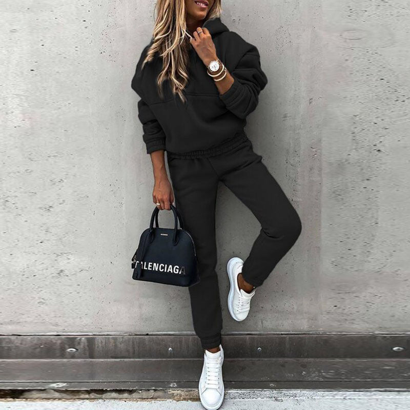 Soft women's grey crewneck sweatshirt, part of a chic jogger set, perfect for cozy casual wear.