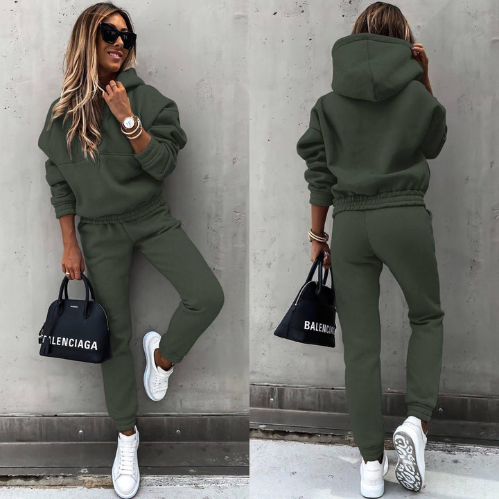 Folded grey women's comfortable chic sweatshirt & jogger set, highlighting soft fabric & stylish casual appeal.