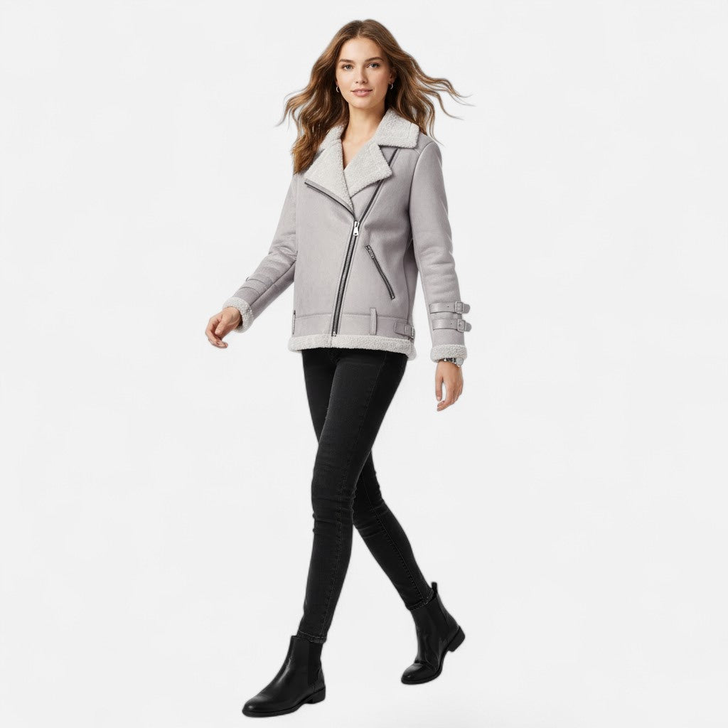 Modern women's moto coat with a sleek side profile, combining chic style & warmth for winter fashion.