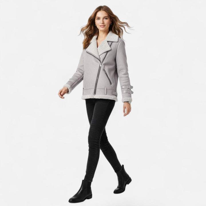 Modern women's moto coat with a sleek side profile, combining chic style & warmth for winter fashion.