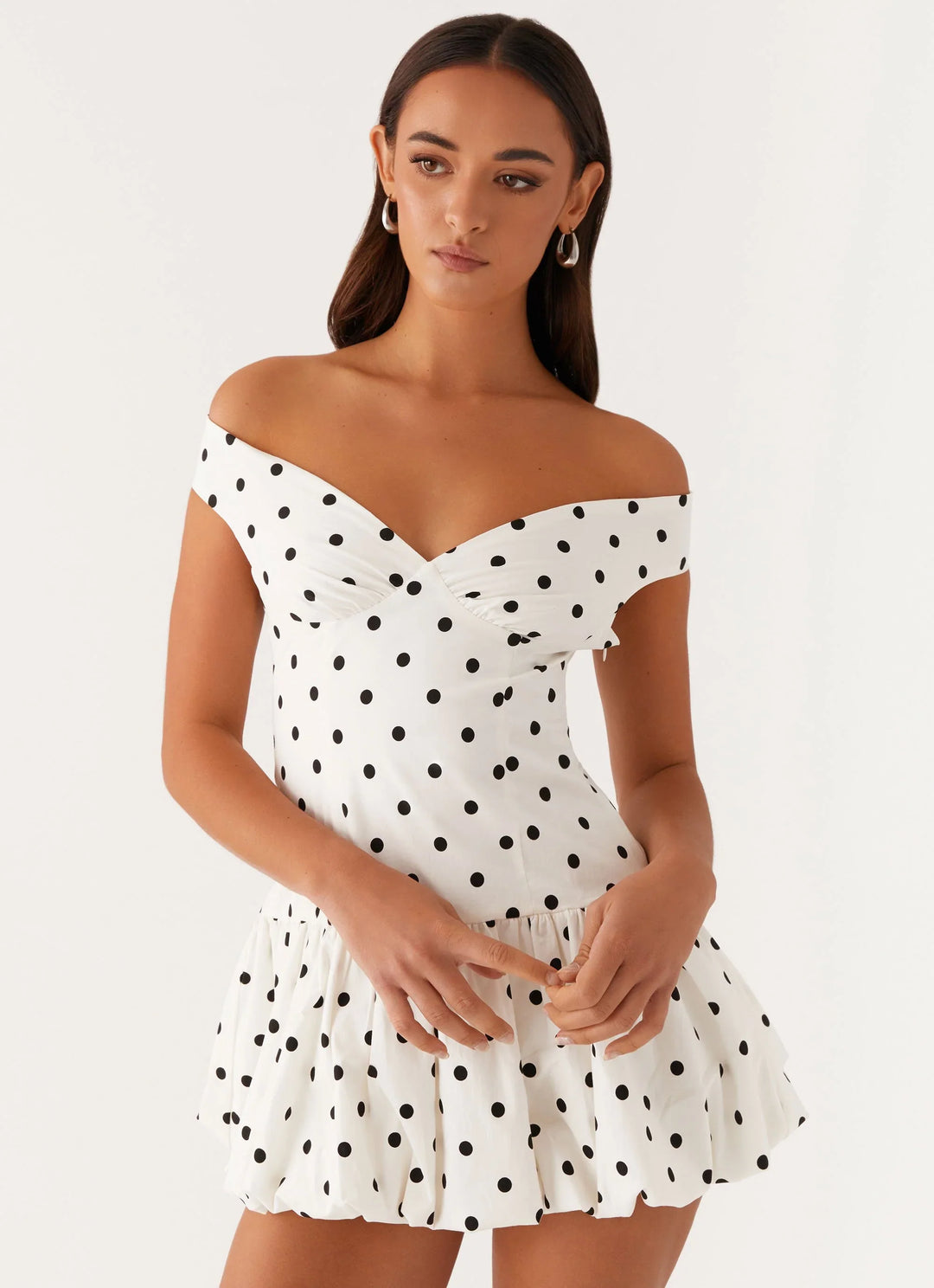 Chic women's off-shoulder polka dot peplum mini dress. Perfect for summer parties & casual elegance.