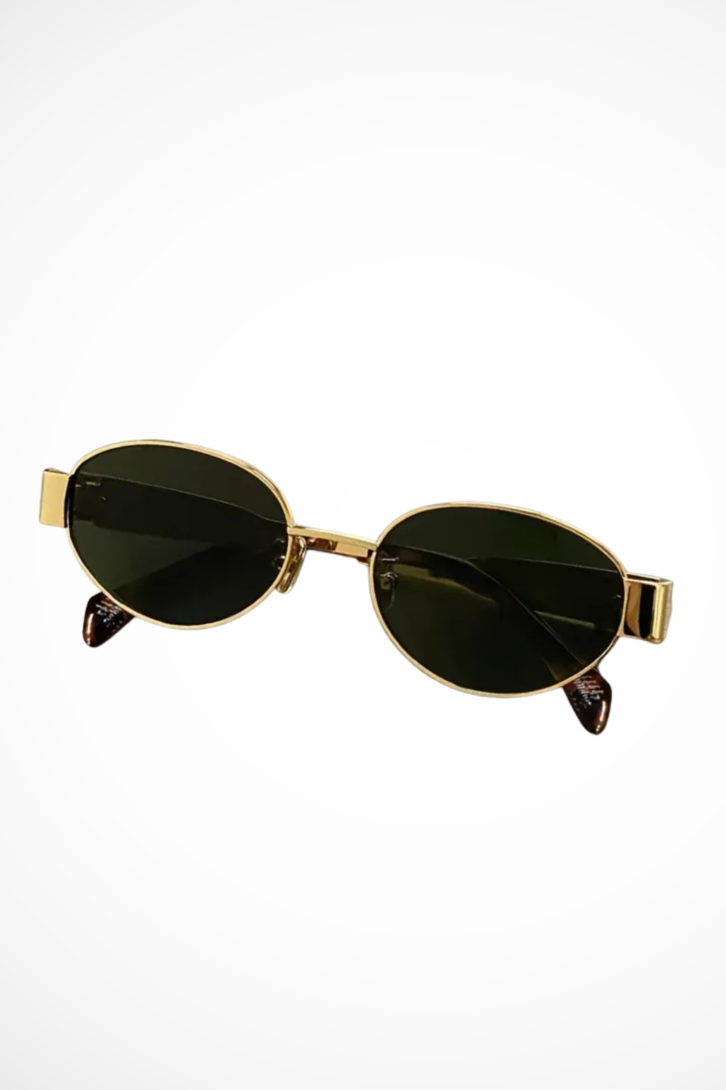 Fashionable women's oval metal frame sunglasses, offering tinted lenses. Elegant and minimalist eyewear.