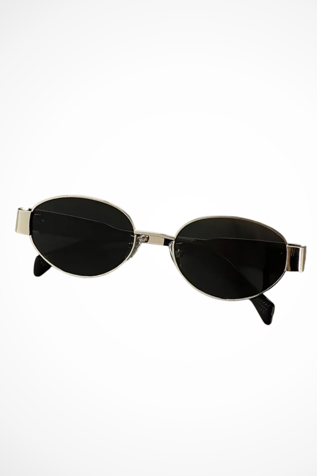 Elegant women's oval sunglasses featuring a slender metal frame and protective tinted lenses. Chic eyewear.