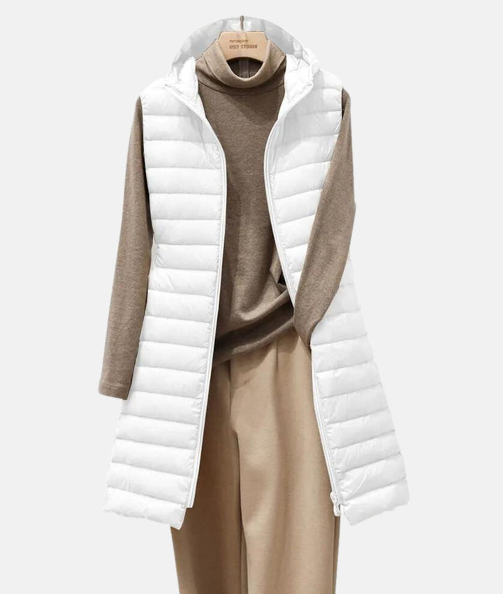 Elegant women's quilted long jacket, ideal for fall & winter. Warm, lightweight, chic, and features a full zip.