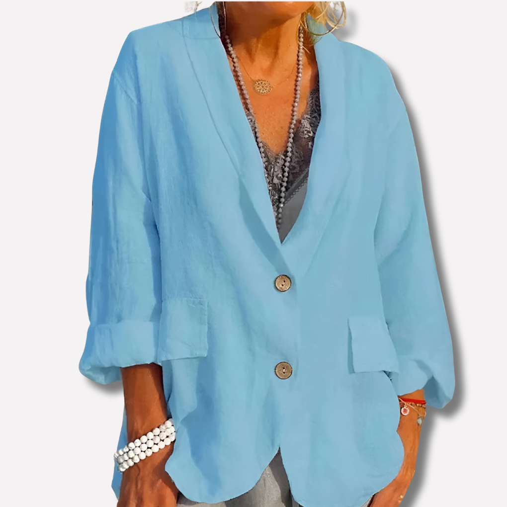 Women's relaxed fit blazer jacket featuring chic button details. A versatile piece for spring style, office or casual outfits.