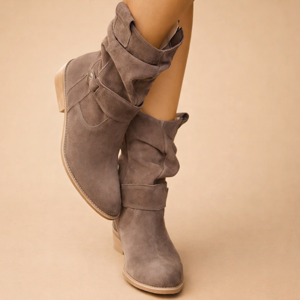 Close-up of chic women's slouch ankle boots, highlighting the elegant buckle and textured design. Winter-ready.