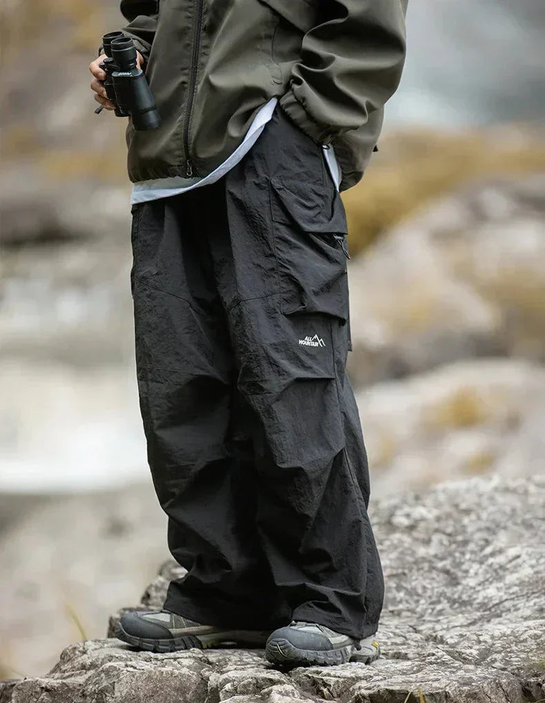 All-weather women's waterproof trousers in an outdoor setting, demonstrating their functional comfort.