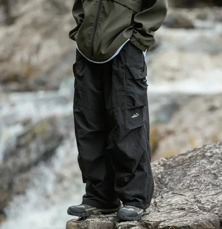 Neatly folded women's chic waterproof pants, emphasizing their quality material and versatile style.