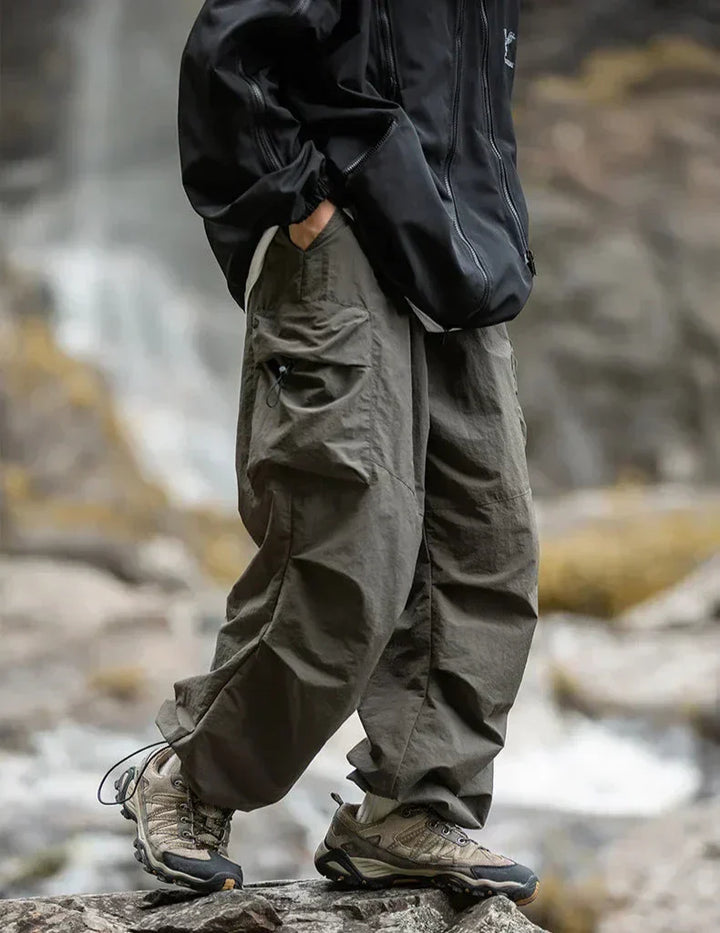 Detail of the chic waistband and secure closure on comfortable women's waterproof trousers.