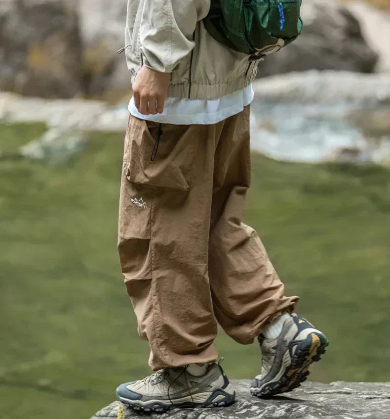 Model showcasing women's chic waterproof pants, highlighting their stylish fit and versatile design.