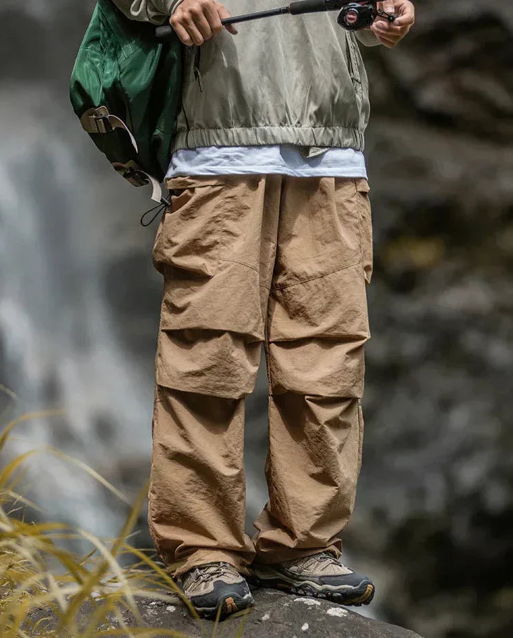 Model sitting comfortably in stylish women's waterproof pants, perfect for casual outings.