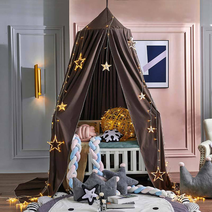 Peace-inducing blackout bed canopy for children, perfect for sleep, play, & nursery decor.