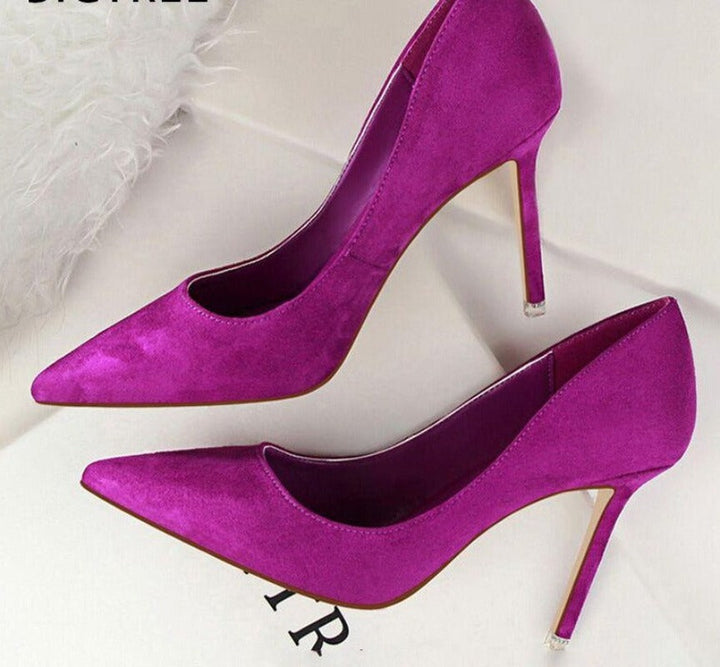 Elegant women's black pumps with stiletto heels, sophisticated office wear.