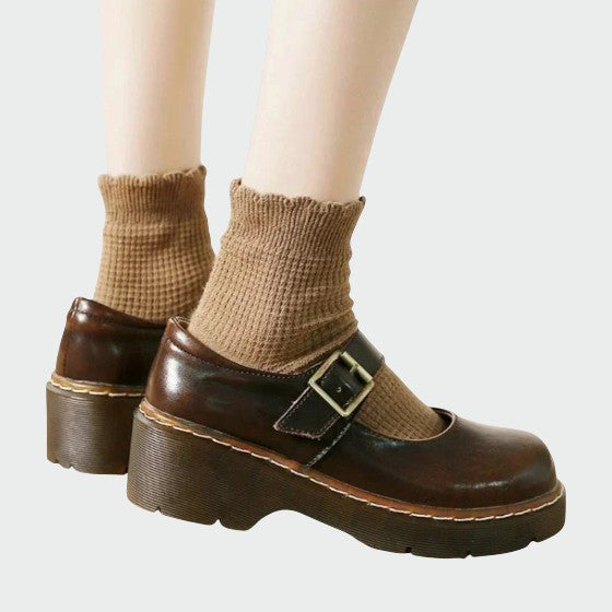 Close-up of classic Mary Jane block heel shoes, showcasing high-quality leather and secure strap