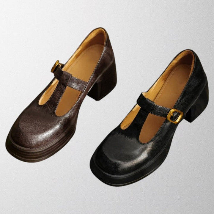 Close-up of a women's classic black Mary Jane shoe with block heel and strap detail