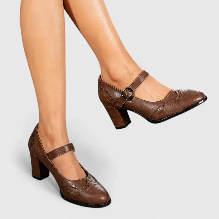 Classic black Mary Jane heel pumps with ankle strap, essential women's elegant work shoes.
