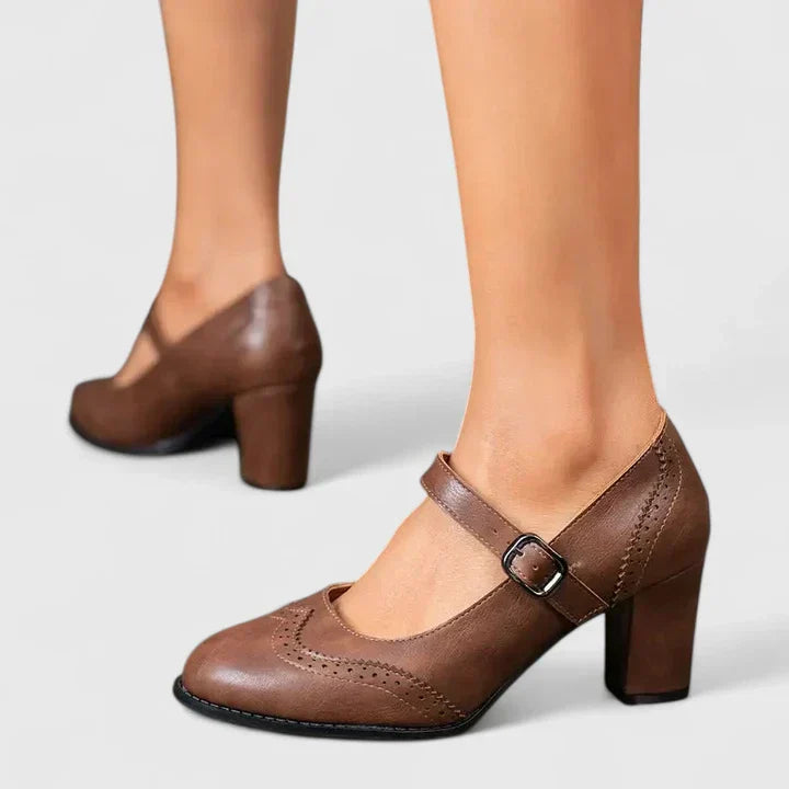 Classic black Mary Jane heels with sturdy buckle, perfect women's elegant footwear for summer.