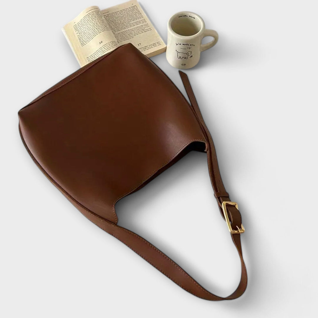 Elegant black shoulder bag for women, minimalist and classic everyday handbag.