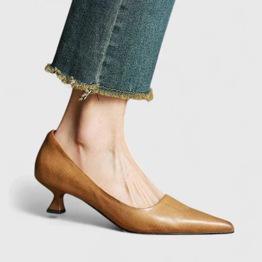 Elegant silver pointed toe low heel pumps for women, suitable for special occasions