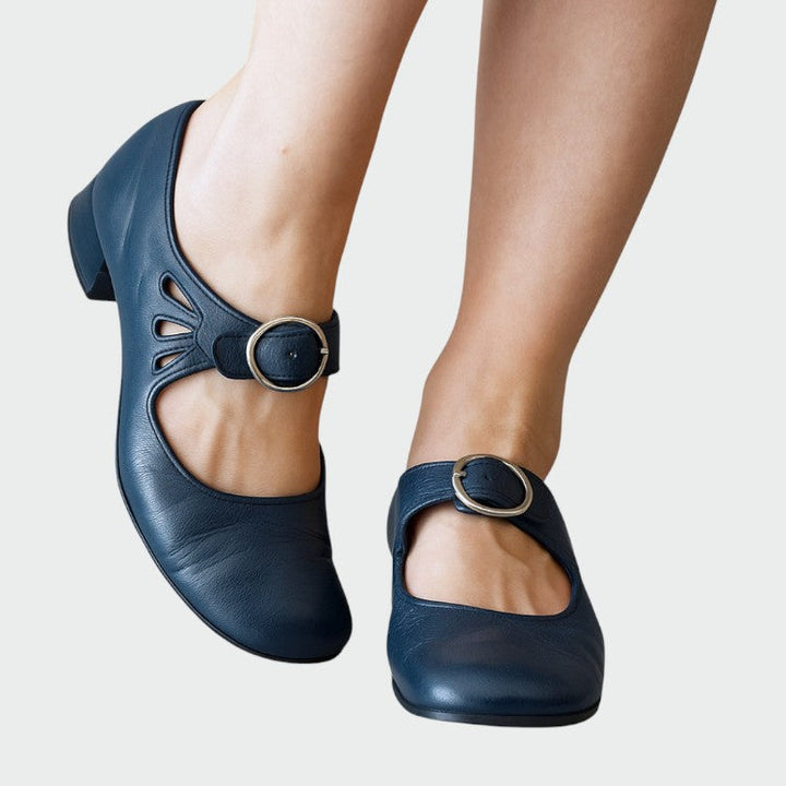 Black Mary Jane shoes with buckle closure, a versatile flat suitable for dress or casual everyday wear.