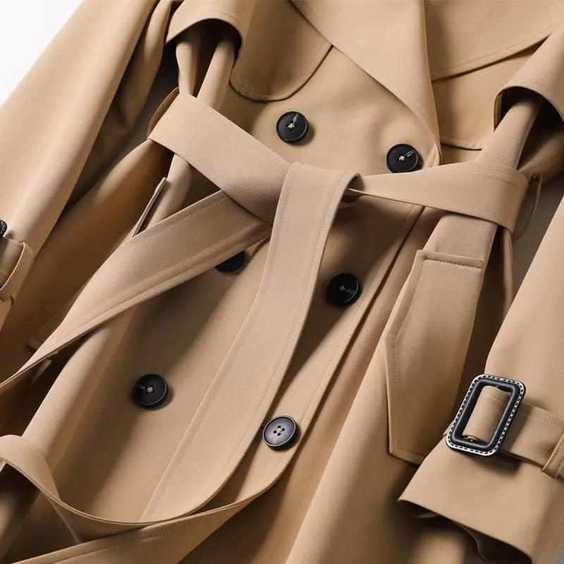 Grey women's autumn jacket, a classic belted trench coat design.