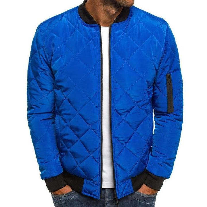 Close-up of men's classic quilted bomber jacket showing zip front and ribbed collar. Everyday fall style.