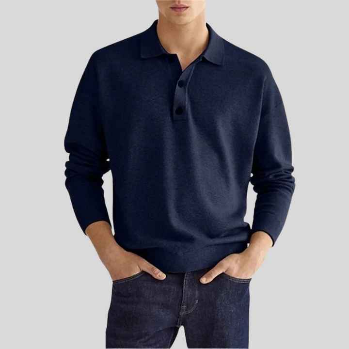 Stylish men's navy blue polo shirt, a timeless classic for versatile smart casual and everyday menswear looks.