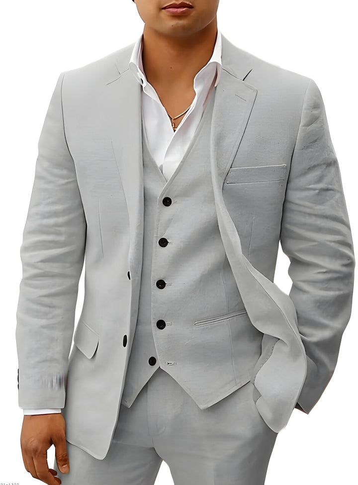 Complete men's classic three-piece suit outfit, styled with accessories for a formal event.