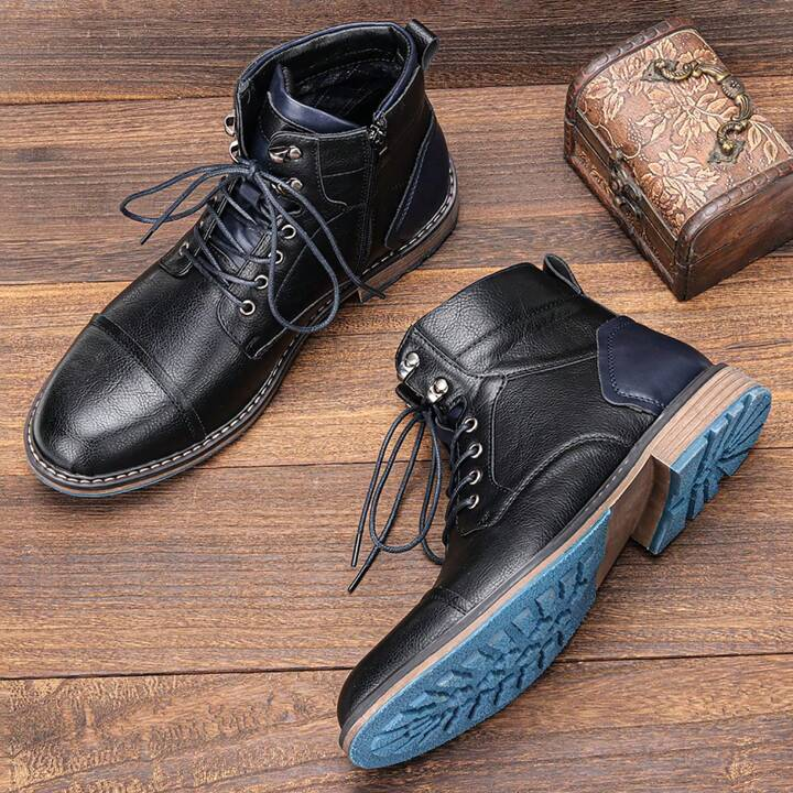 Close-up: Detail of side zipper on men's vintage lace-up ankle boots, emphasizing quality and convenience.