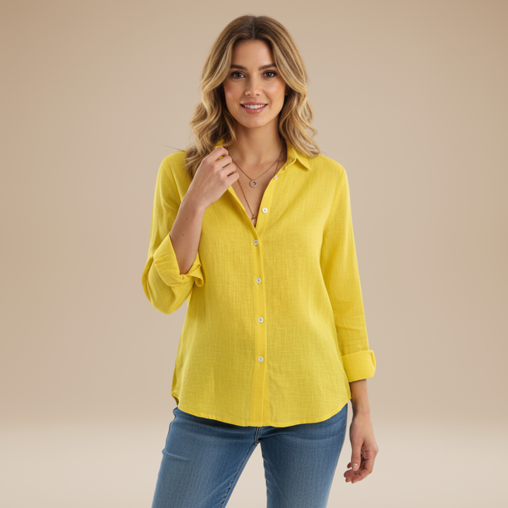 Modern grey women's button-up shirt, a versatile long-sleeve top, ideal for office wear and casual style.