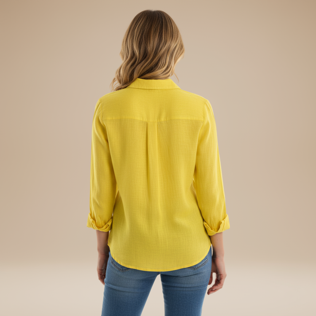 Vibrant yellow women's long-sleeve button-up shirt, a fashionable classic for office and casual wear.