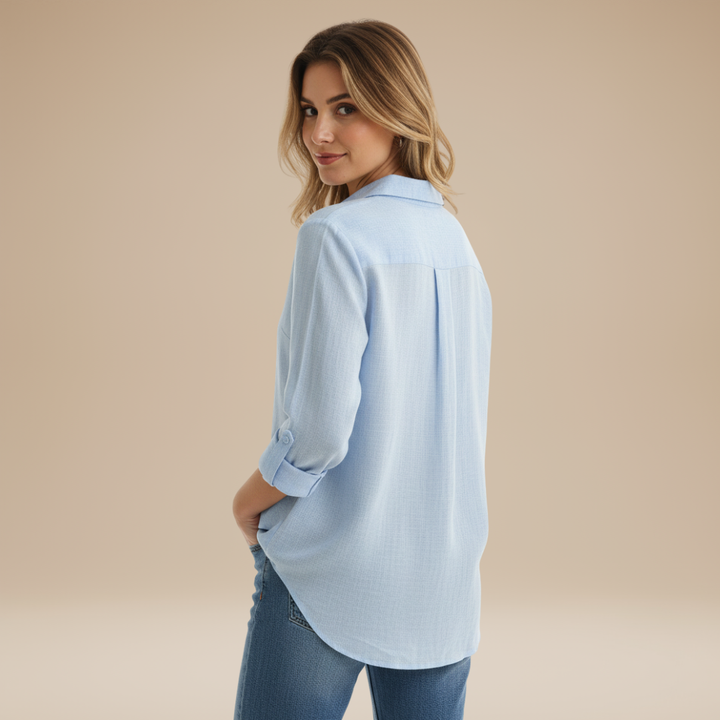 Versatile grey long-sleeve button-up shirt for women, a timeless essential for any wardrobe.