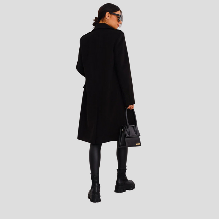 Elegant double-breasted long coat for women, a timeless piece of fall and winter fashion.
