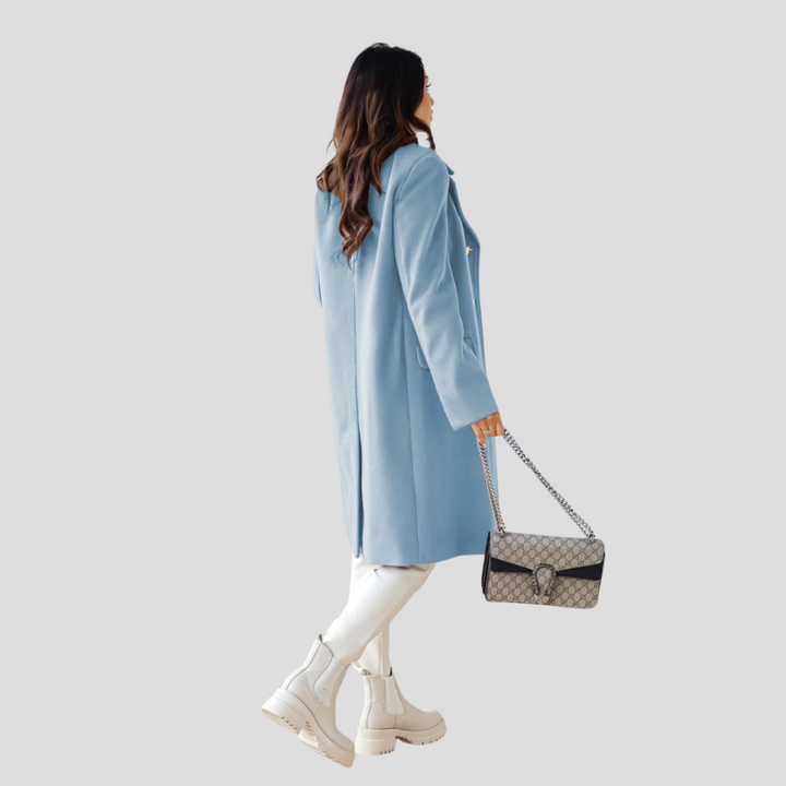Front view of a tailored women's long coat with a chic double-breasted closure.