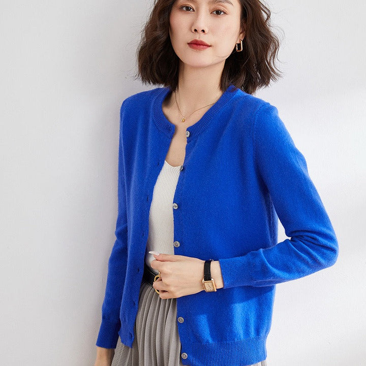 Elegant women's classic round neck cardigan sweater, ideal for office attire or smart casual looks. Long sleeve.