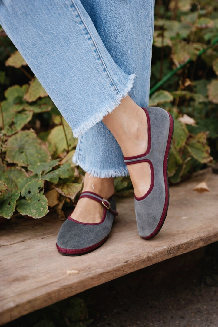 Elegant black Mary Jane ballet flats with a comfortable round toe and secure buckle strap.