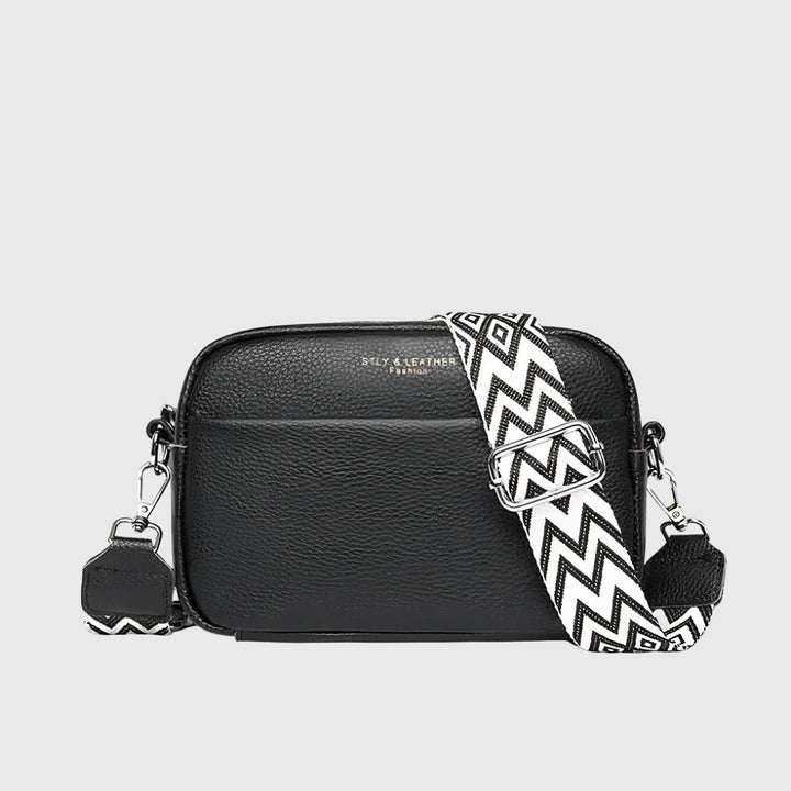 Classic women's shoulder bag in black, structured design, perfect for everyday use or summer outfits.