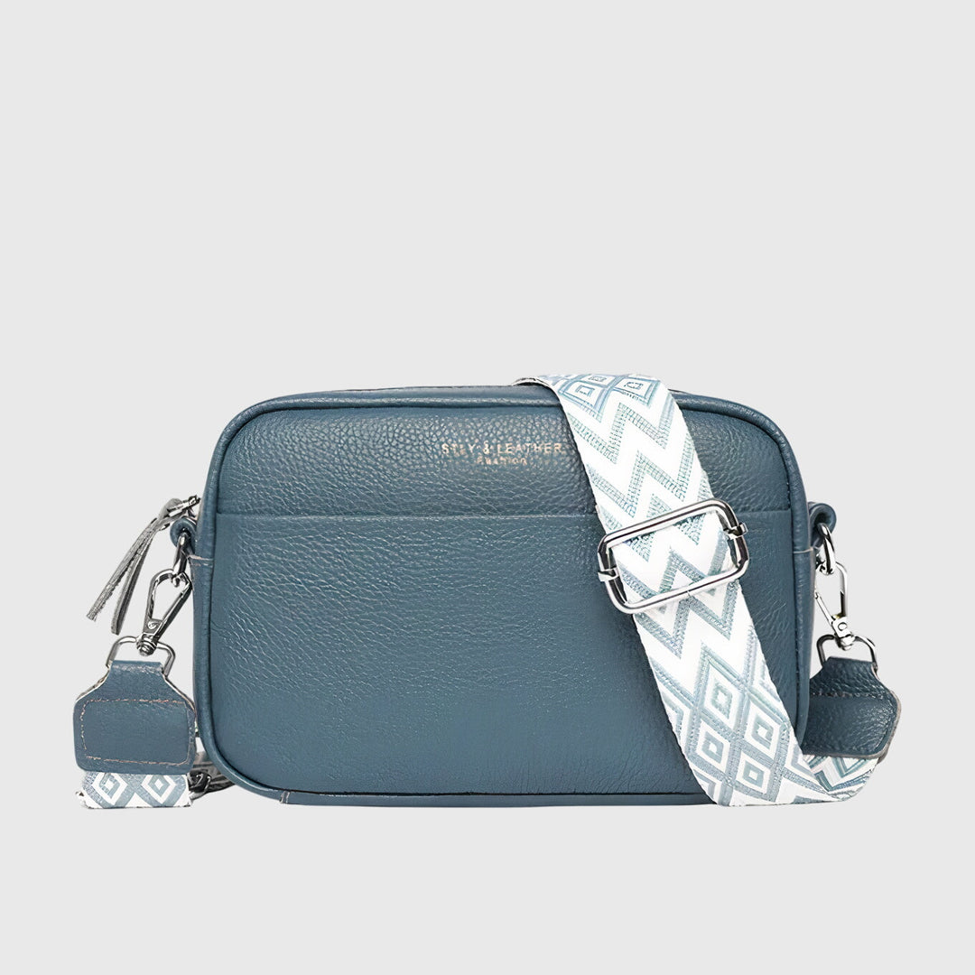Fashionable women's everyday bag, convertible from shoulder to crossbody, in a sleek black finish.