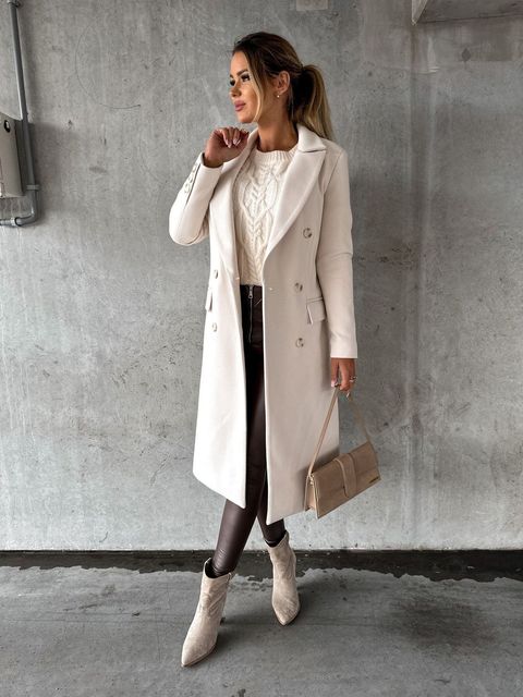 Stylish women's coat, double-breasted for winter warmth & elegance in cold weather.