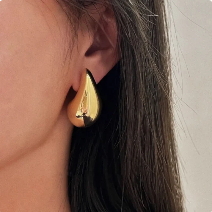 Pair of sophisticated dangle earrings, women's gold-plated jewelry, ideal for elegant occasions.
