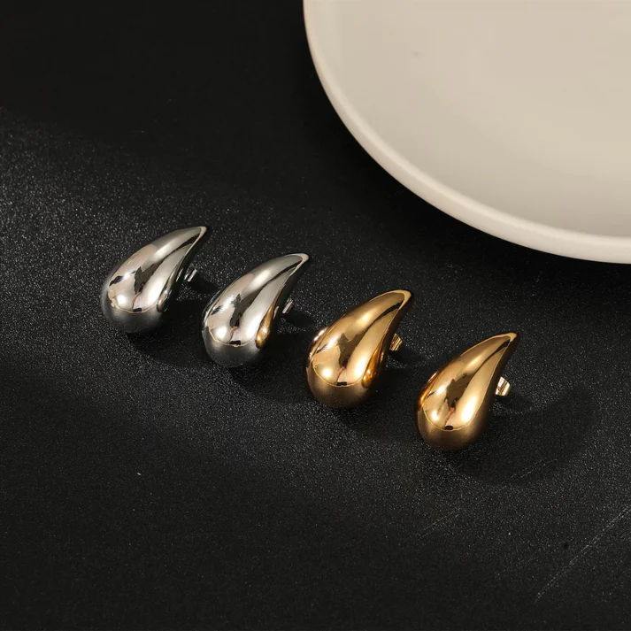 Modern women's elegant silver drop earrings, a stylish fashion accessory for any outfit.