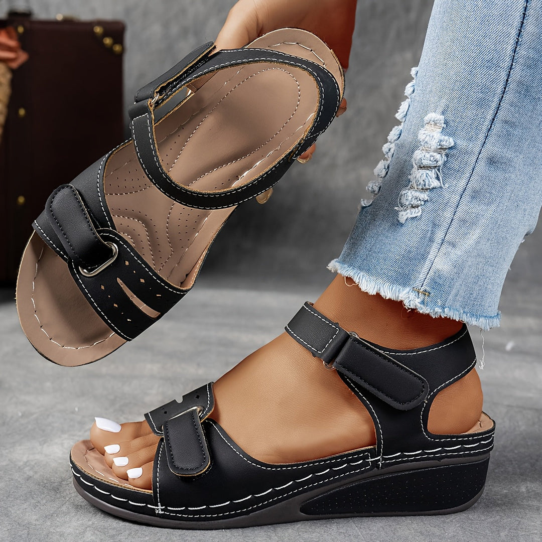 Pair of women's adjustable orthopedic sandals with arch support, perfect for summer comfort.
