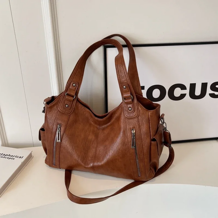 Close-up of women's vegan leather shoulder bag texture, soft and durable material