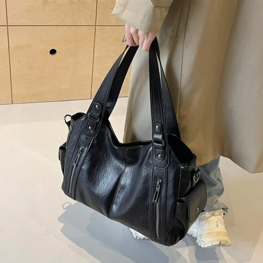 Women's shoulder bag in cognac, featuring adjustable strap and spacious interior