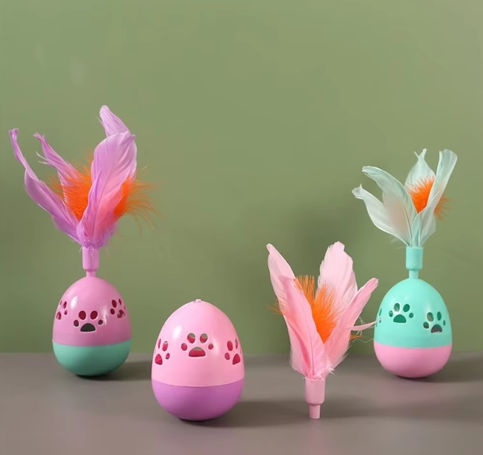 Bright multi-color pet toy ball with feathers, ideal for interactive play.